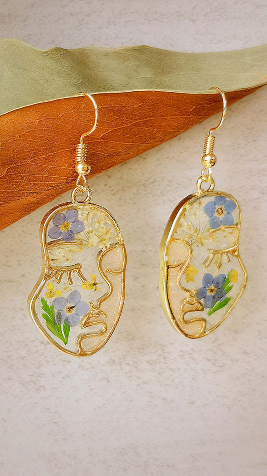 Pendientes con rostro de flor pintada